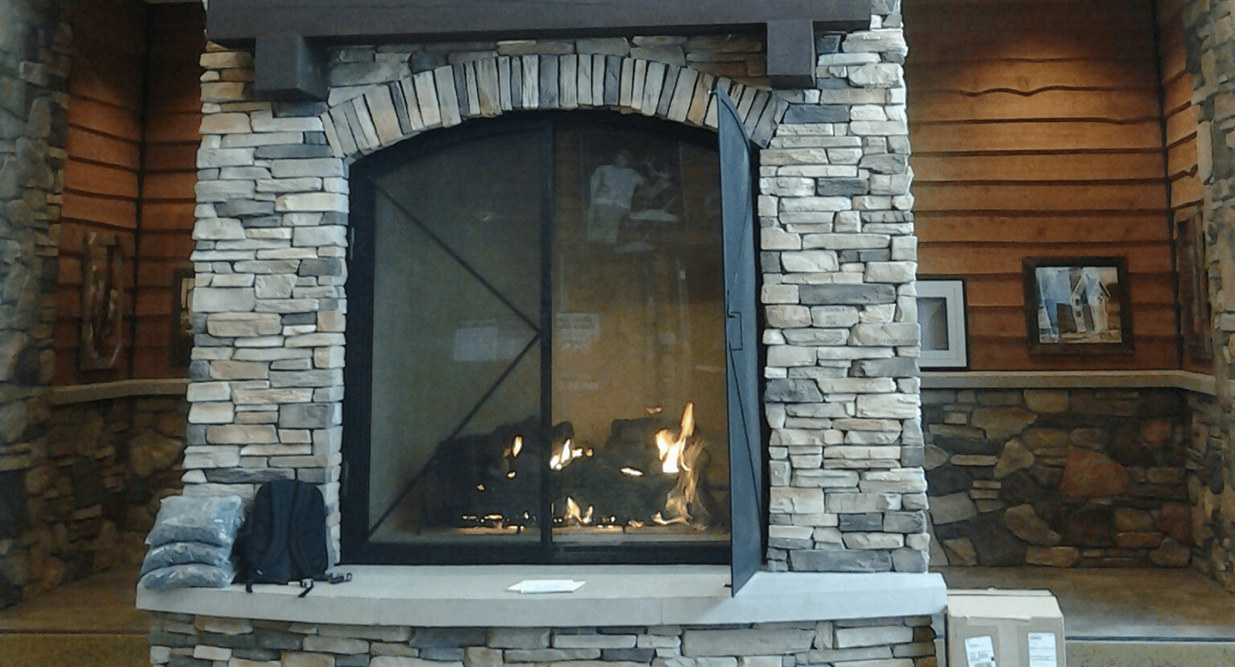 Gray tone manufactured stone veneer fireplace