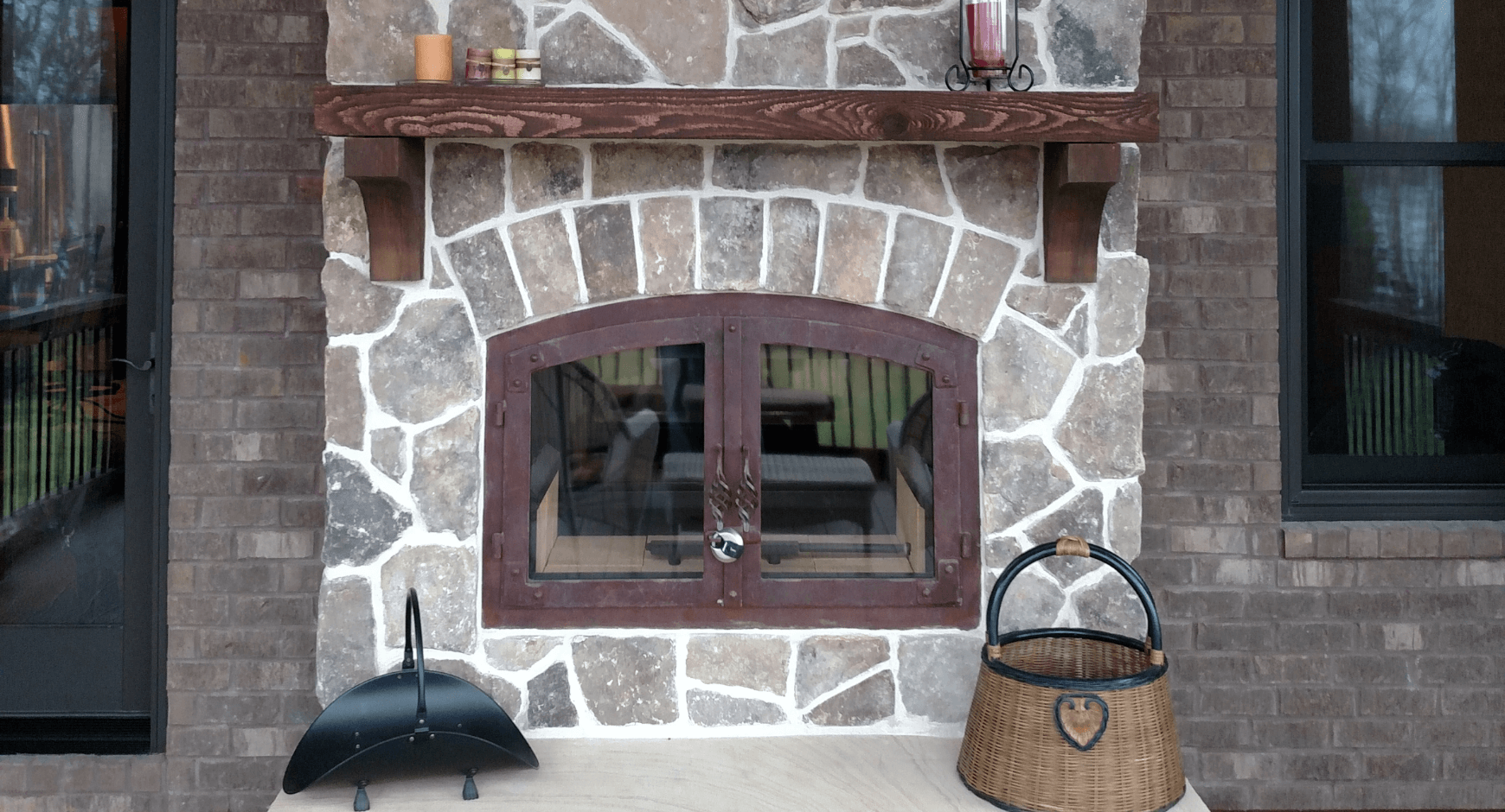 Mortared stone veneer around an iron door fireplace