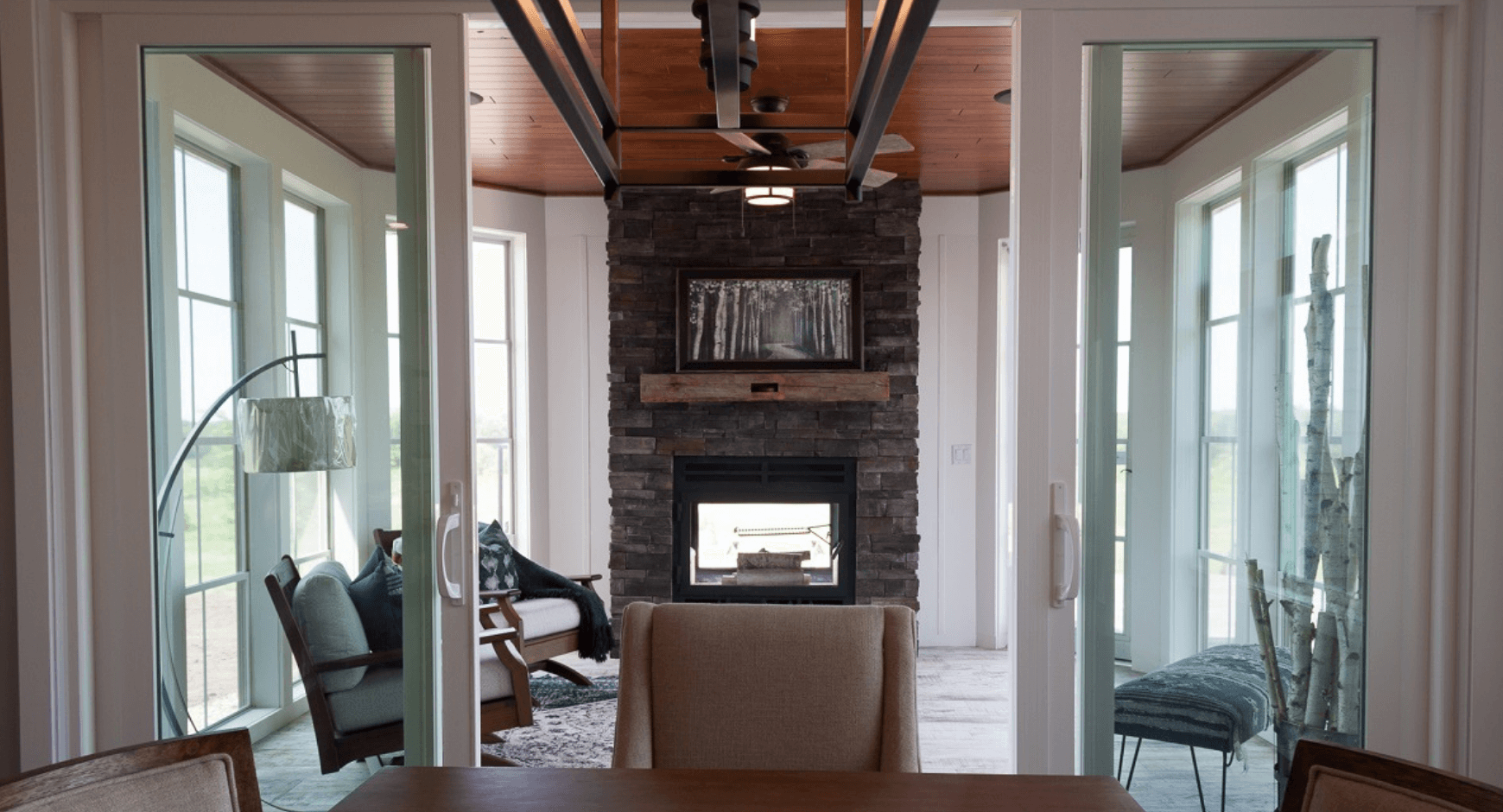 Floor to ceiling dry stacked stone veneer fireplace 