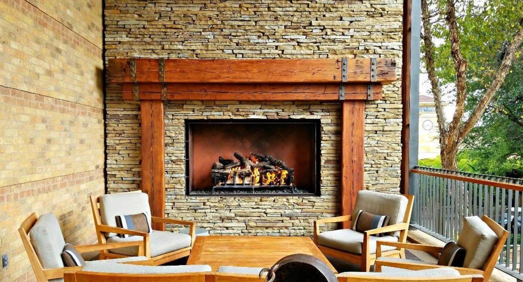 wood mantel on stone veneer fireplace