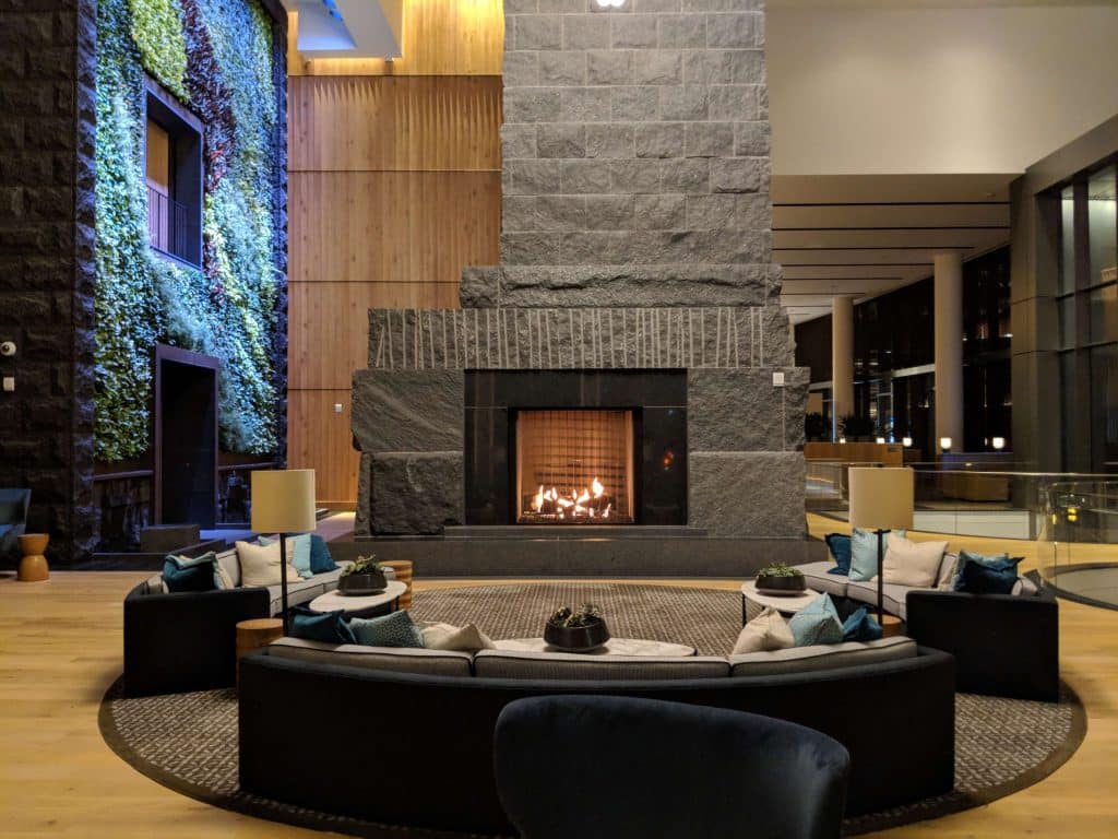 a large see through fireplace in a large lobby area