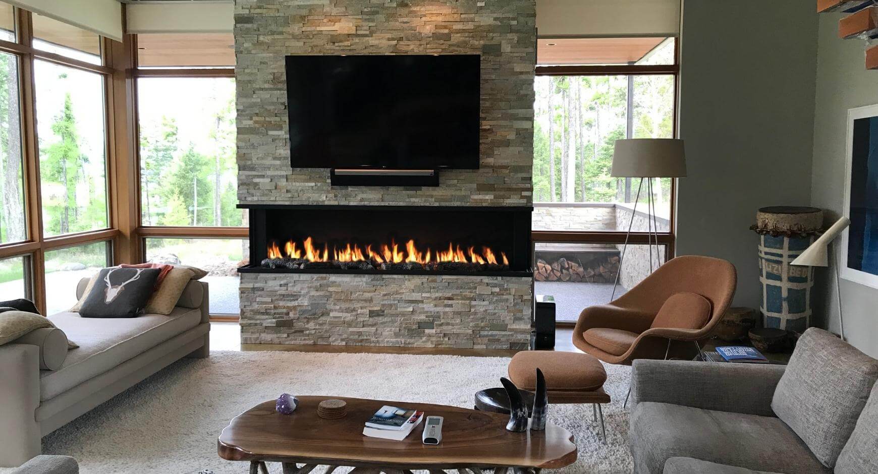 tv above stone fireplace