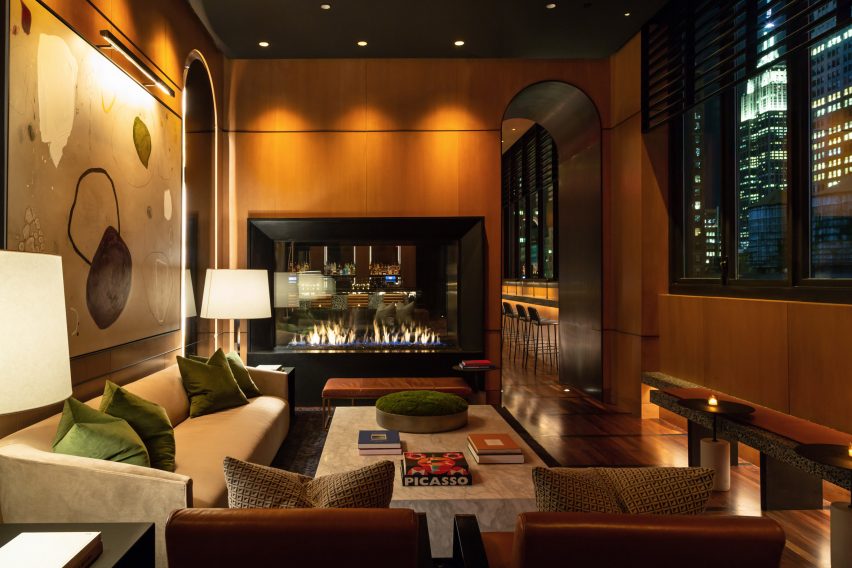 ultra contemporary luxury nyc hotel lounge with expansive double sided gas fireplace