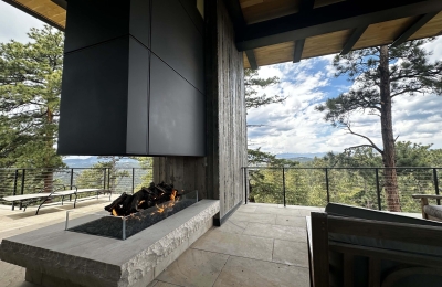modern open view fireplace with gas logset in luxury home overlooking the colorado mountains
