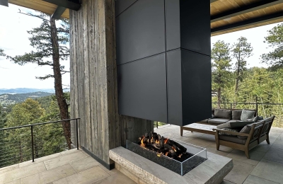 modern open view fireplace with gas logset in luxury home on patio overlooking the colorado mountains