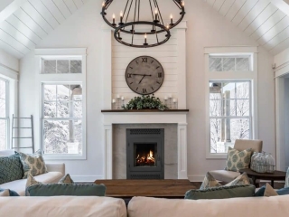 rustic farmhouse living room with wood burning fireplace