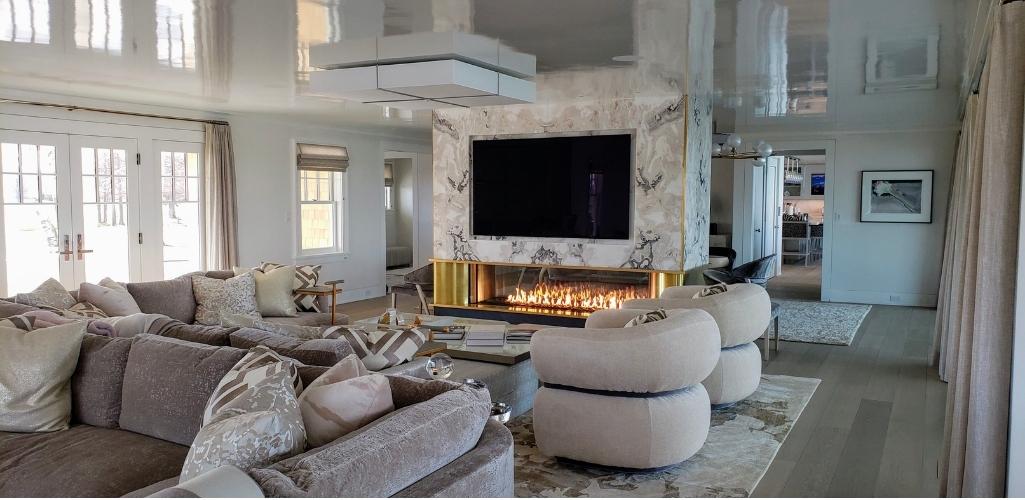 a fireplace in a living room with a tv over it