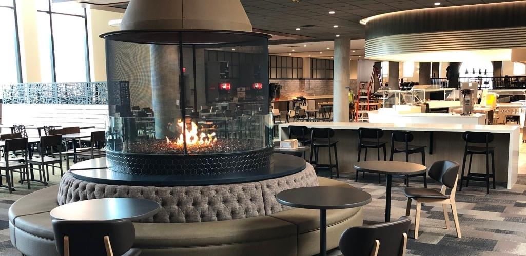 a university dining hall with an custom fireplace