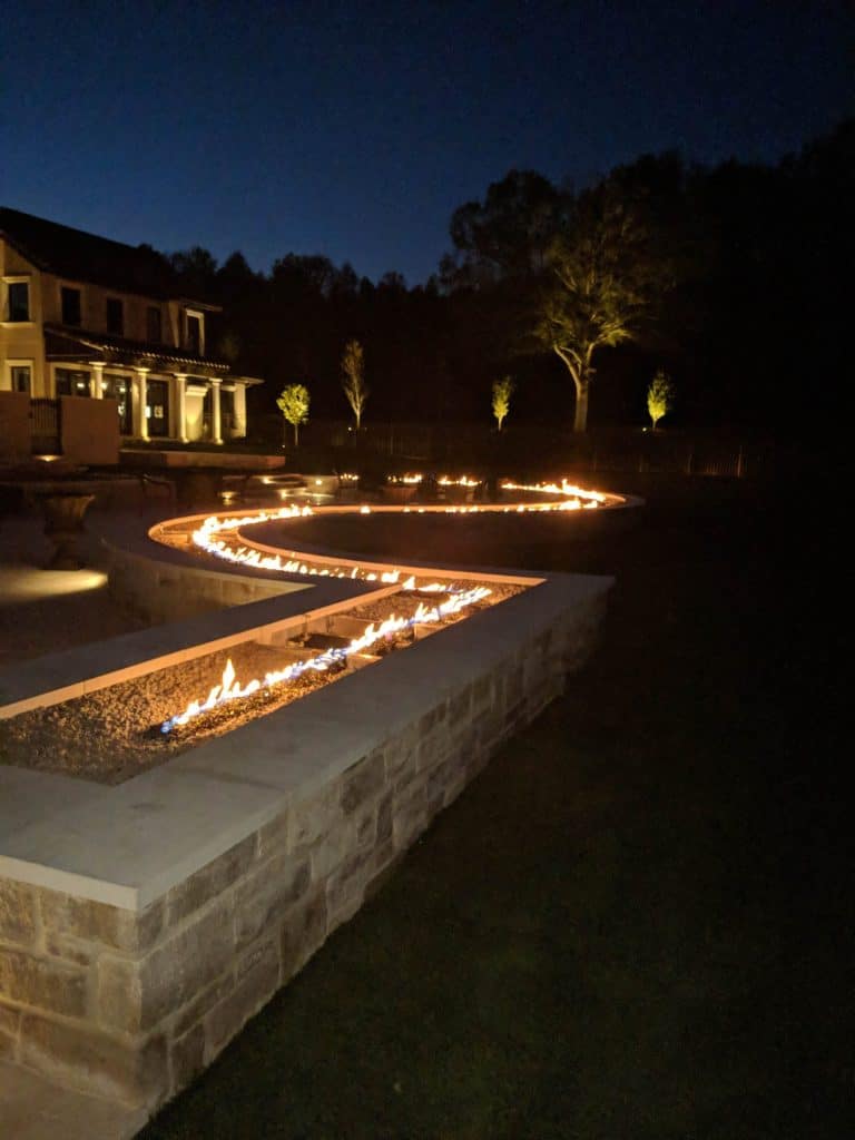 a perimeter fire burner in a residential backyard