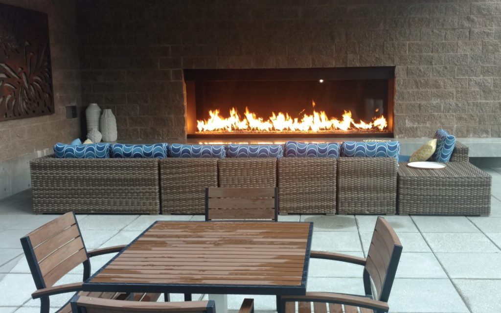 a luxury outdoor fireplace for tenant amenity space