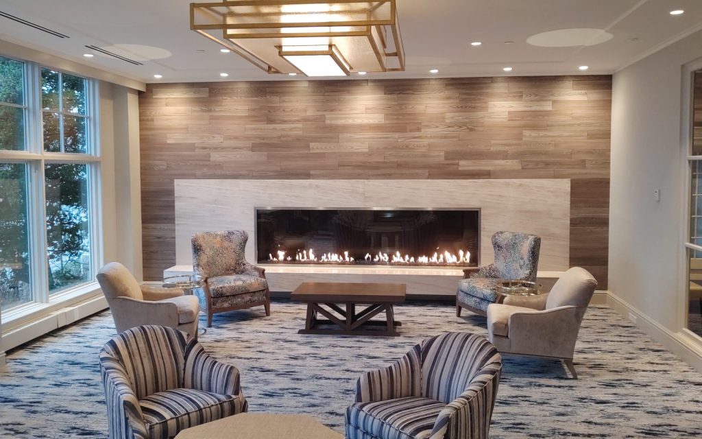 modern gas fireplace idea for a clubhouse lounge
