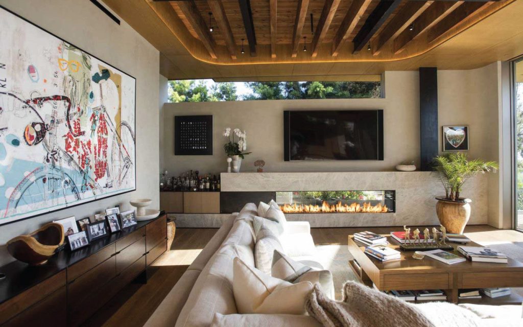 a cozy art deco style living room with a modern indoor outdoor gas fireplace