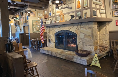 traditional style fireplace with gas logset for rustic homey restaurant