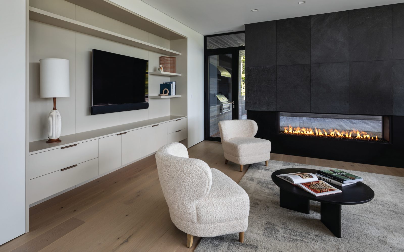 scandinavian-style-living-room-with-large-double-sided-two-way-gas-fireplace