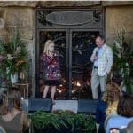 Dolly Parton standing in front of Acucraft custom fireplace at Dollywood HeartSong Resort