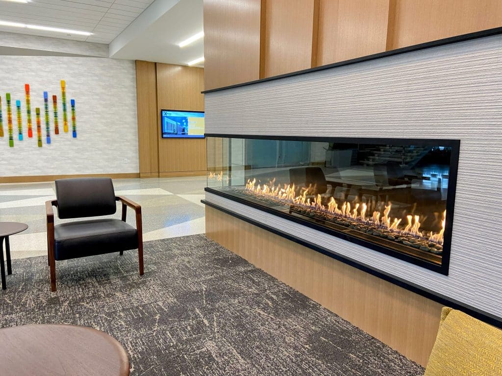 Acucraft Custom Linear Front & Side Gas Fireplace with Glass Meda & River Rock (4)