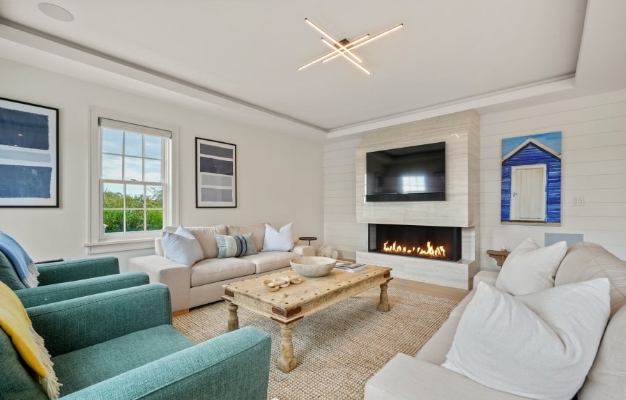 Bright living room with a custom panoramic natural gas fireplace