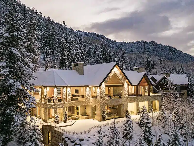 an image of a luxurious estate in the snowy aspen covered mountains