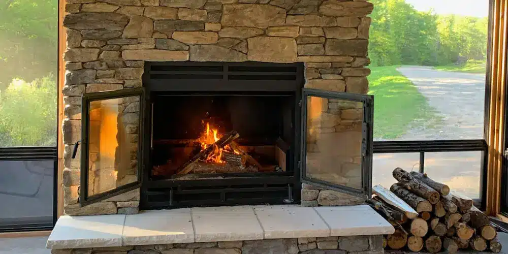 an image of a single sided wood burning fireplace with double doors