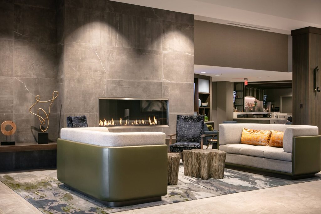 A sleek Blaze Collection gas fireplace in a modern setting, showcasing stylish finishes and fire media options.