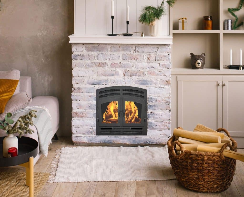 a compact wood burning fireplace in a cozy beige living room with stone surround