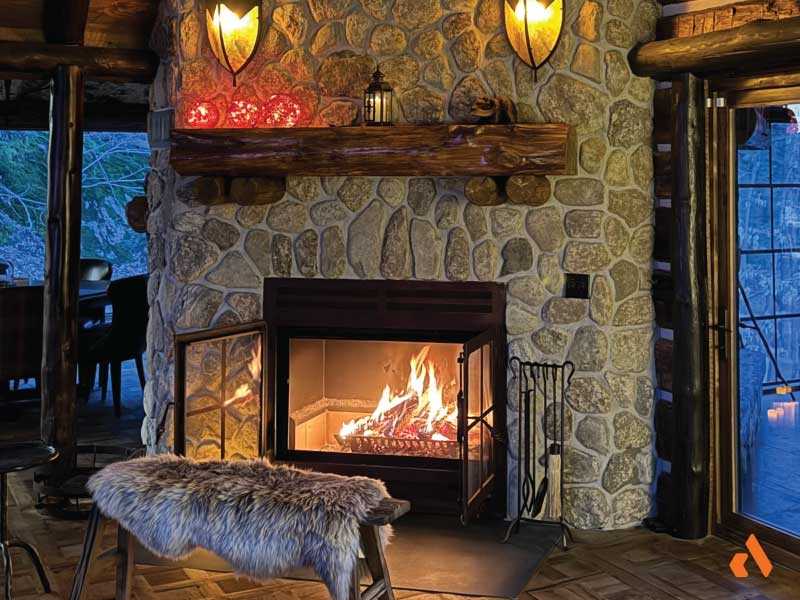 traditional cabin open hearth style wood fireplace