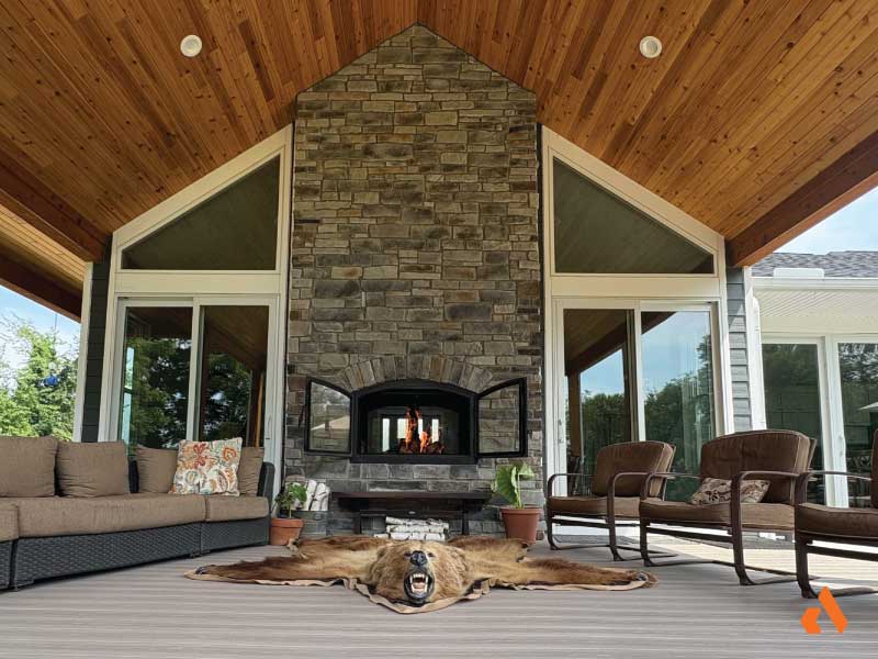inside outside see through wood fireplace on deck