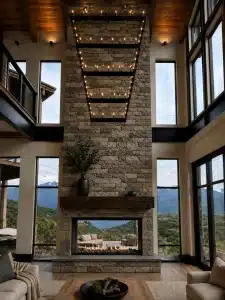 See-through Blaze Open fireplace connecting indoor and outdoor living spaces.