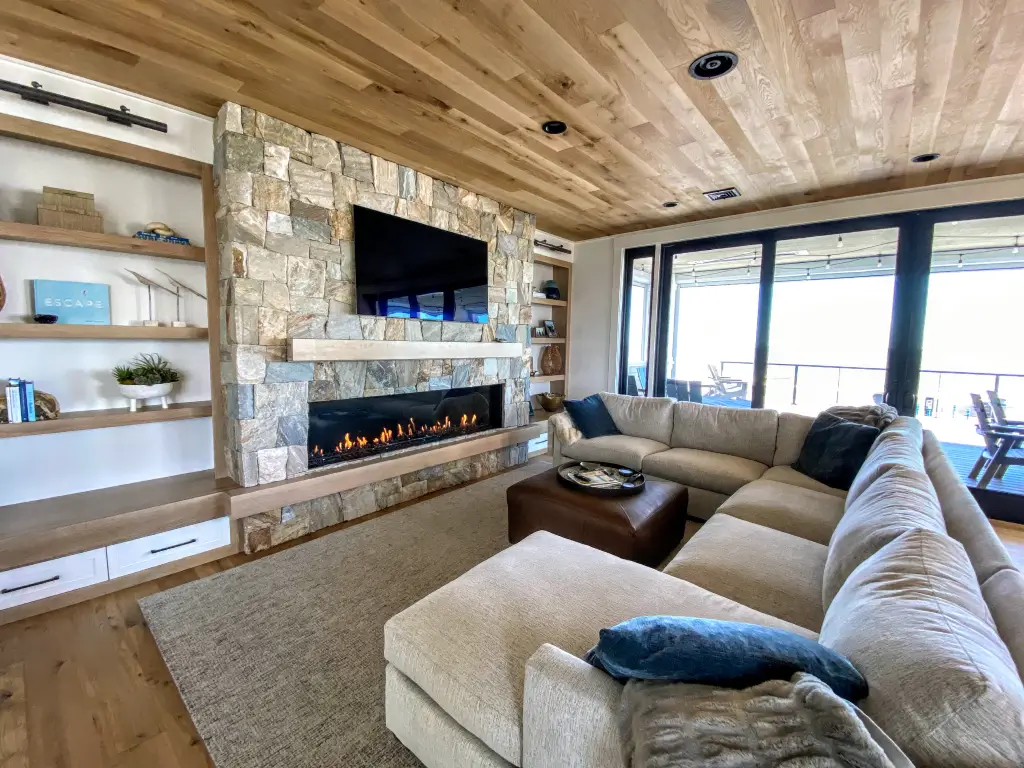 Acucraft Signature Series 7-foot single-sided linear gas fireplace in a stone feature wall