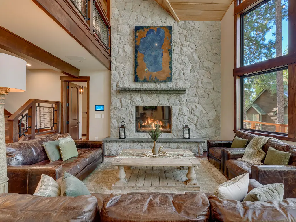 Acucraft Timeless see-through gas fireplace in a stone feature wall