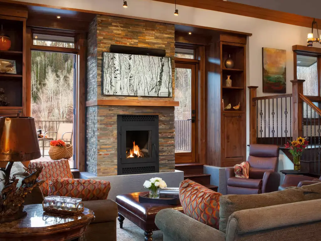 Acucraft American single-sided wood-burning fireplace in a warm living room