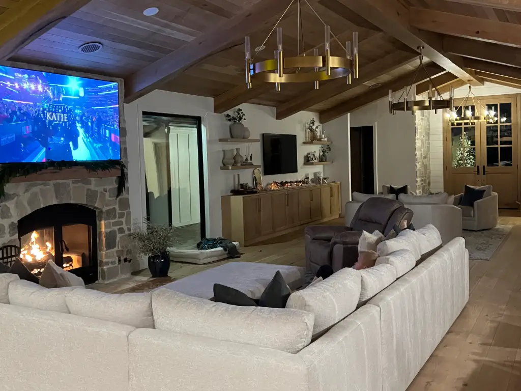Acucraft wood-burning fireplace beside a seating area in a retreat home