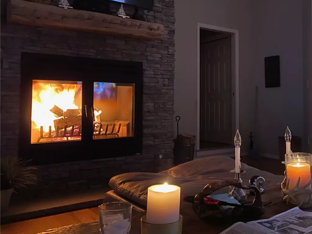 Glowing Acucraft wood fireplace in a retreat living room
